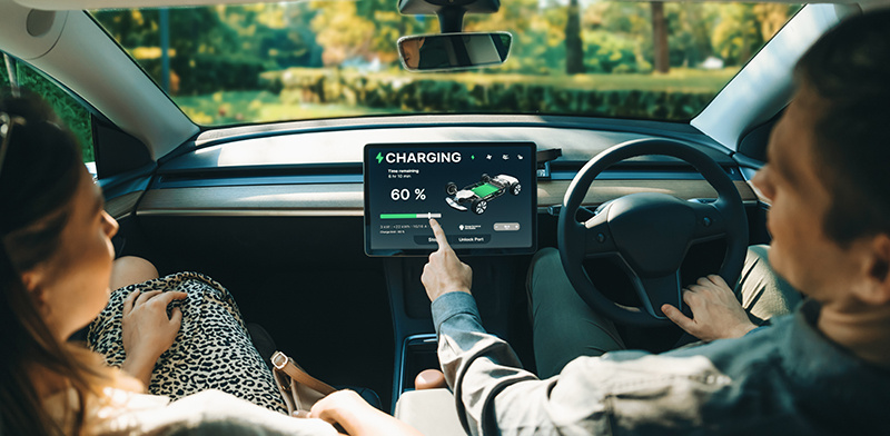 Two people enjoying their electric vehicle